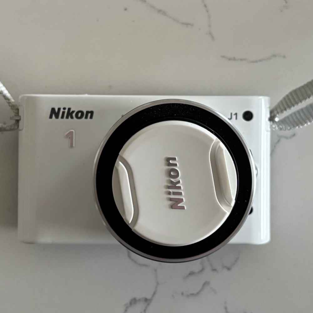 Nikon 1 J1 Camera in White with Accessories